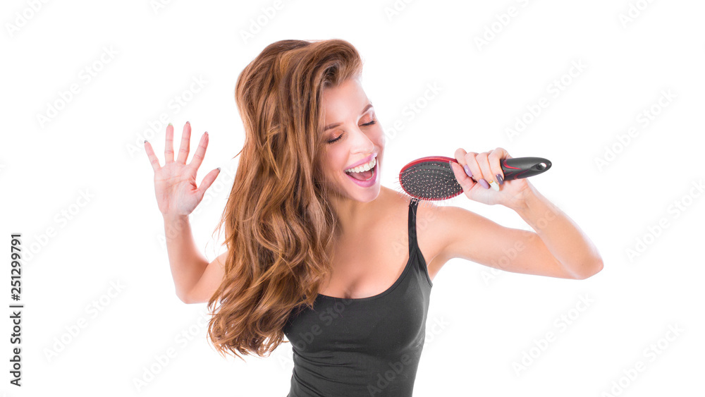 emotional blonde woman singing with hair comb, isolated on white. Hair care concept emotional blonde woman singing with hair comb, isolated on white. Hair care concept