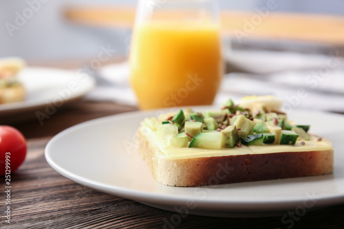 Tasty avocado sandwich on plate, closeup