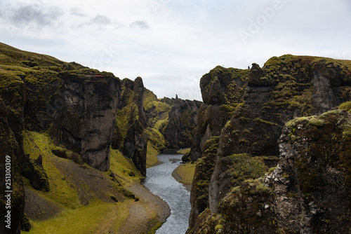 Fjadrargljufur canyon steep cliffs and waters of Fjadra river, south Iceland 