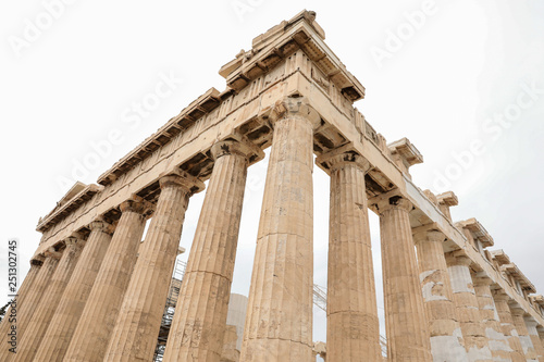Athens, Greece - February 23, 2019: Fragment of Ancient Greek architectural elements of Eastern facade of the Parthenon temple on the Acropolis of Athens, Greece.