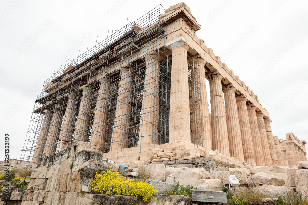 Athens, Greece - February 23, 2019: Western facade of the Parthenon temple on the Acropolis of Athens, Greece under reconstruction during winter 2019.