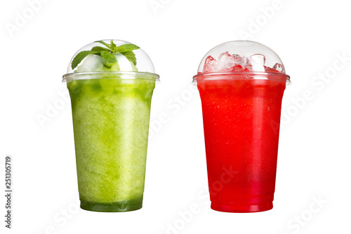 Delicious fruit smoothies in plastic cups, on a white background. Two cocktails with berry and fruit flavors.