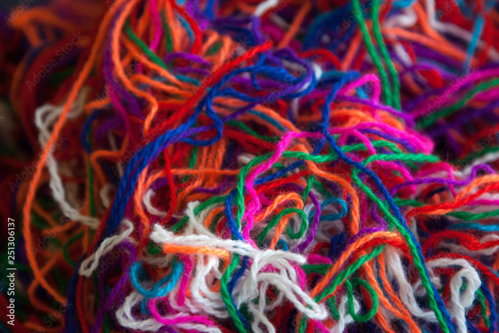 The intricated multi-colored yarn threads, close up