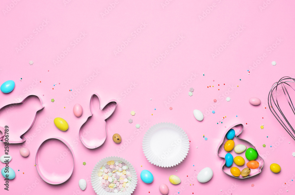 Easter Concept, Cookie Cutters, Eggs, Sugar Sprinkles and Chocolate Eggs on Bright Background
