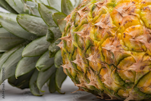 Close up of pineapple isolated against a plain background