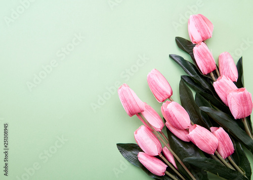 Bunch of tulip flowers on green