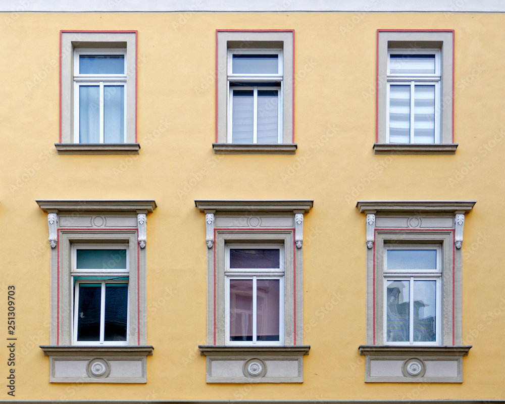 Europe, vintage building facade detail with windows pattern