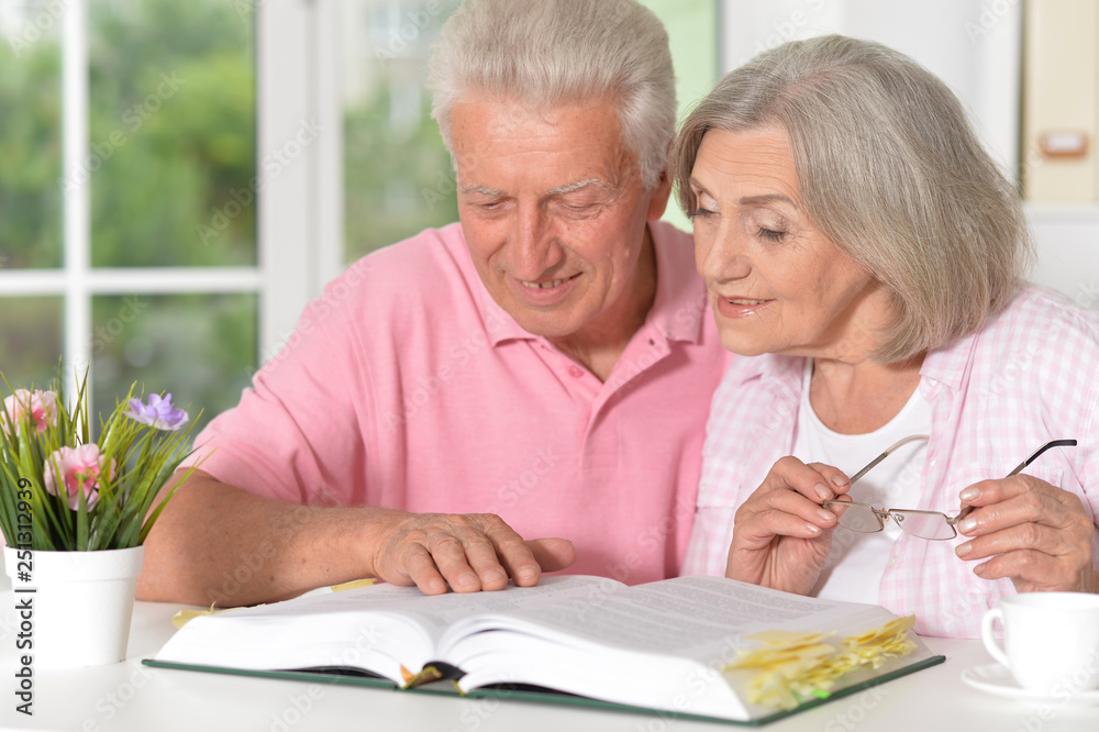 Portrait of senior couple with book drinking tea Portrait of senior couple with book drinking tea