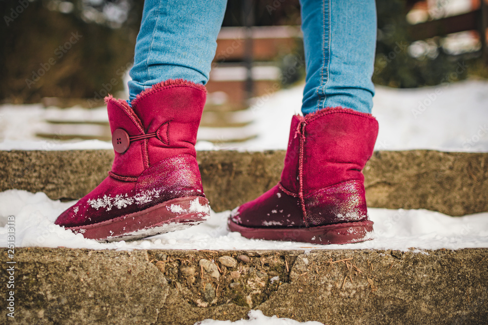 Girl in red ugg boots in texas pants, jeans Stock Photo | Adobe Stock