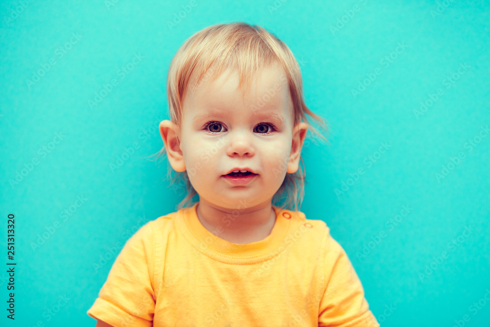 photo of a little girl on a blue background photo of a little girl on a blue background