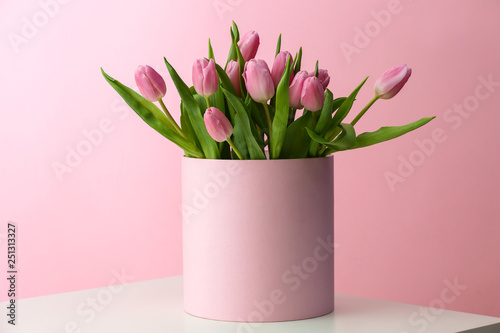 Fototapeta Naklejka Na Ścianę i Meble -  Box with bouquet of beautiful tulips on table