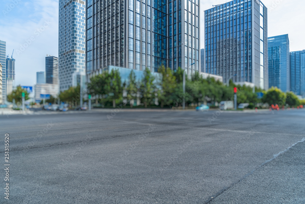 empty asphalt road front of modern buildings. empty asphalt road front of modern buildings.