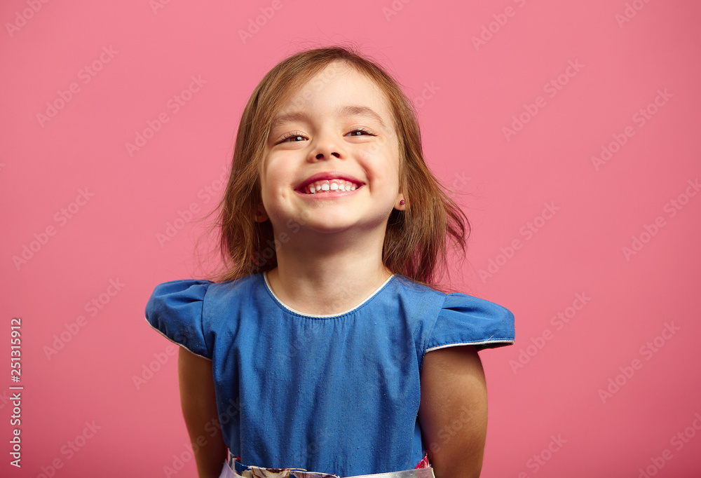 Female portrait of charming child of three years with a beautiful smile. - obrazy, fototapety, plakaty 