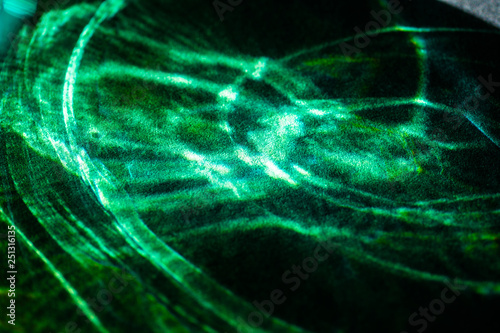 abstract light glow, lens flare, caustics water glas reflections.  light through a prism. black background. 