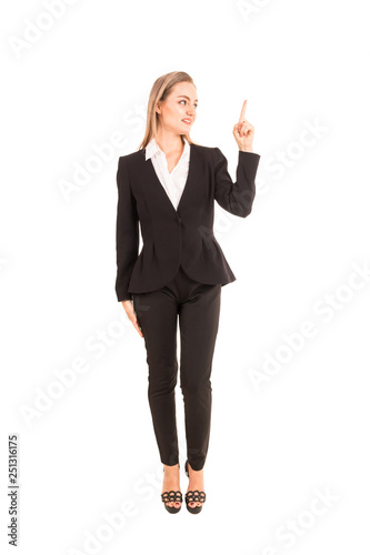 Businesswoman pointing to empty copy space isolated on white background