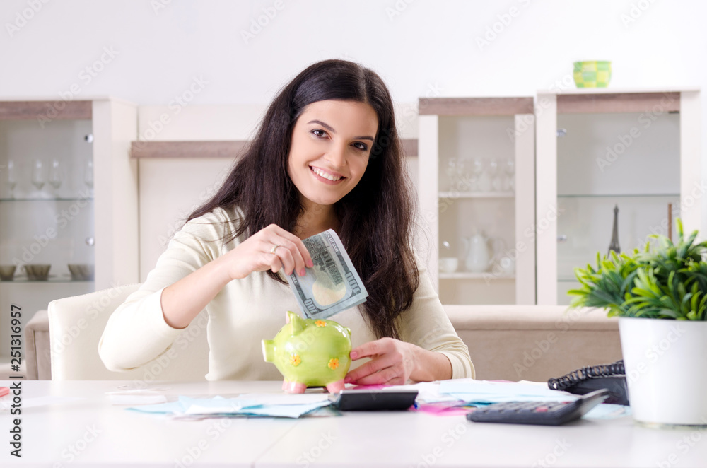 Young woman with receipts in budget planning concept Young woman with receipts in budget planning concept