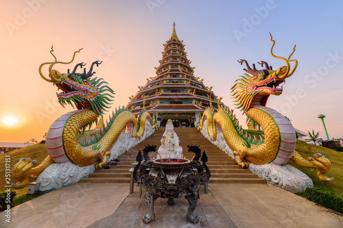 Dragon statue in front of pagoda