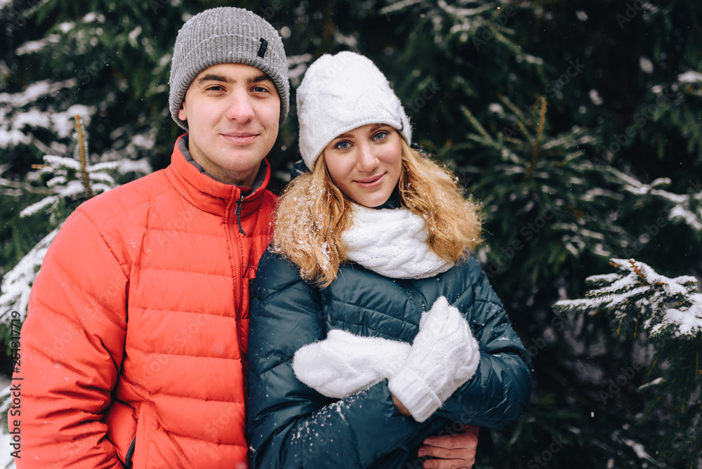 winter couple in city park winter couple in city park
