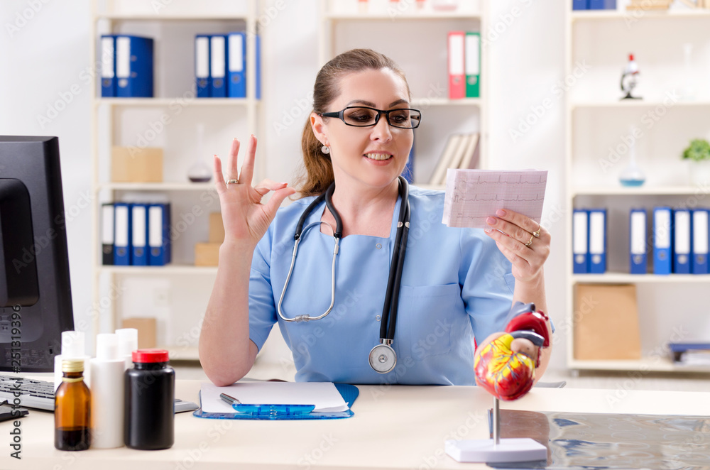 Female doctor cardiologist working in the clinic Female doctor cardiologist working in the clinic