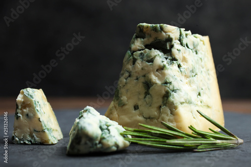 Sliced blue cheese with rosemary