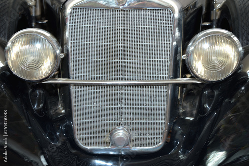 Front bumper and headlights of  vintage car © Alexey Antipov