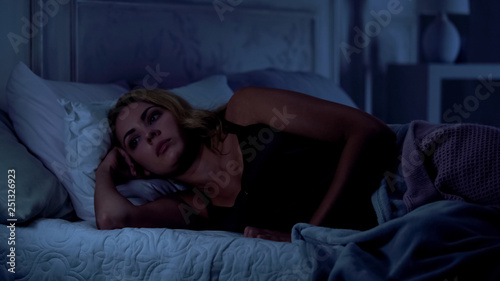 Pretty woman cannot sleep at night, overanxiety after stressful day, insomnia
