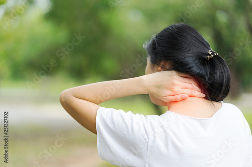Young woman suffering from neck pain, Health concept.