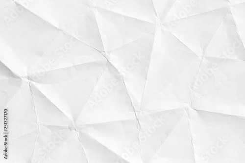 Texture of old crumpled origami paper, white background in modern style. 3D shapes of curved lines for patterns and wallpapers.