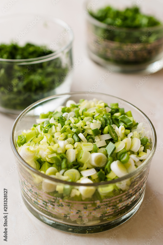 Chopped Chives, Parsley and Dill in Glass Bowls. Chopped Chives, Parsley and Dill in Glass Bowls.