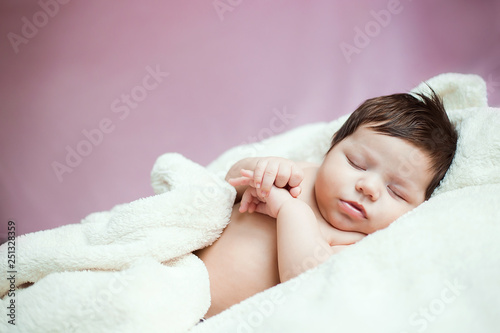 baby, newborn baby cute blue-eyed, dark hair, baby 2 months without clothes sleeps