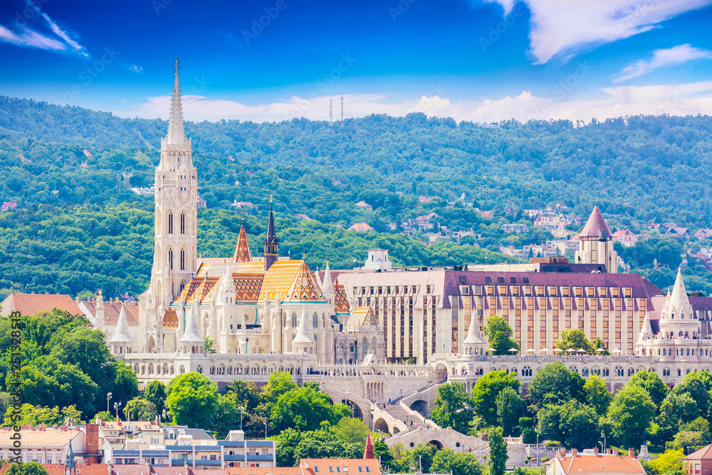 View of Buda side of Budapest with St. Matthias church and Fishermen's Bastion. Summer sunny day. View of Buda side of Budapest with St. Matthias church and Fishermen's Bastion. Summer sunny day.