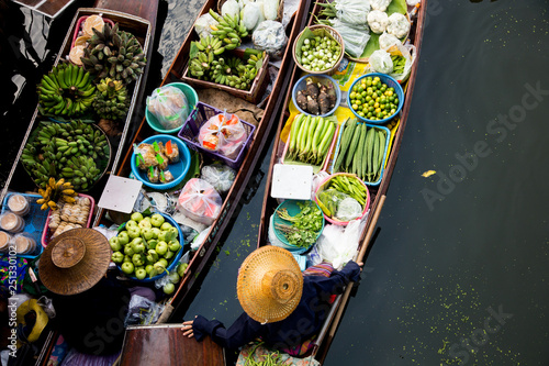 Tha Kha floating market in Thailand. Local farmers selling vegetables. © Leckerstudio