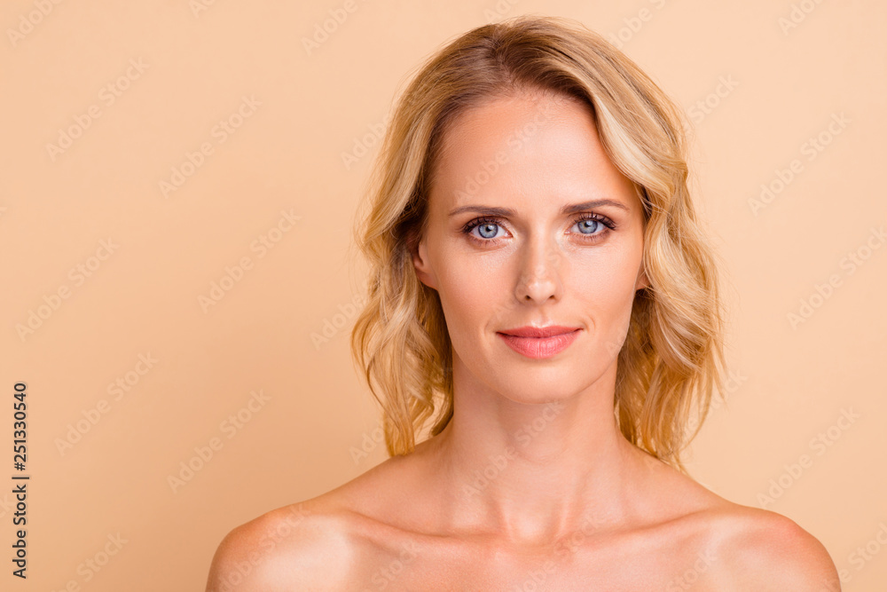 Close-up portrait of nice attractive charming adorable calm nude wavy-haired lady with flawless smooth shine fresh clean skin isolated over beige pastel background Close-up portrait of nice attractive charming adorable calm nude wavy-haired lady with flawless smooth shine fresh clean skin isolated over beige pastel background