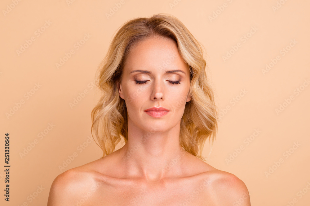 Close-up portrait of nice attractive charming calm nude wavy-haired lady with flawless smooth shine fresh clean clear perfect skin closed eyes isolated over beige pastel background Close-up portrait of nice attractive charming calm nude wavy-haired lady with flawless smooth shine fresh clean clear perfect skin closed eyes isolated over beige pastel background