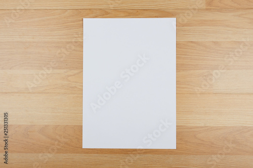 White template paper and space for text on wooden background