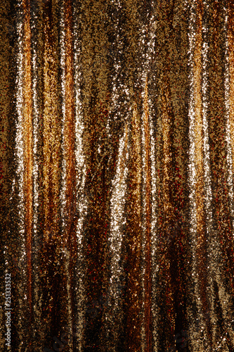 Abstract golden glitter background. Festive background with copy space.