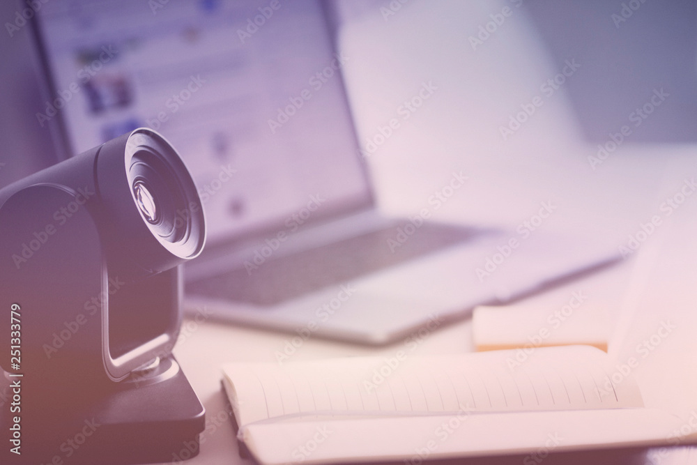 Video camera for business meetings, laptop and IP phone on the office table. Close up. Video camera for business meetings, laptop and IP phone on the office table. Close up.