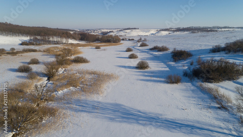 Aerial view of ukranian winter landscape with long shadows