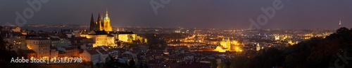 Prague - The panorama of the Town with the Castle and St. Vitus cathedral at dusk.