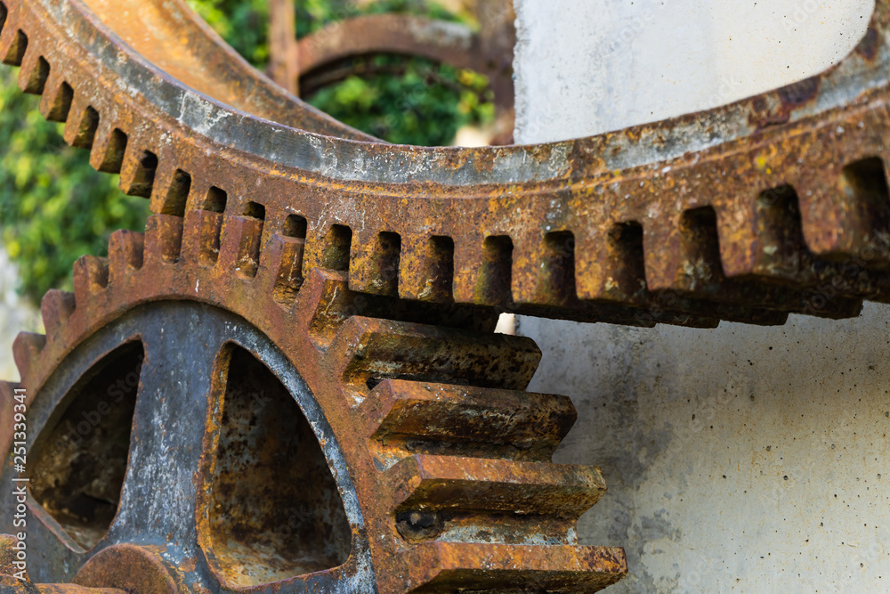 Old rusty waterwheel. Detail of the gears