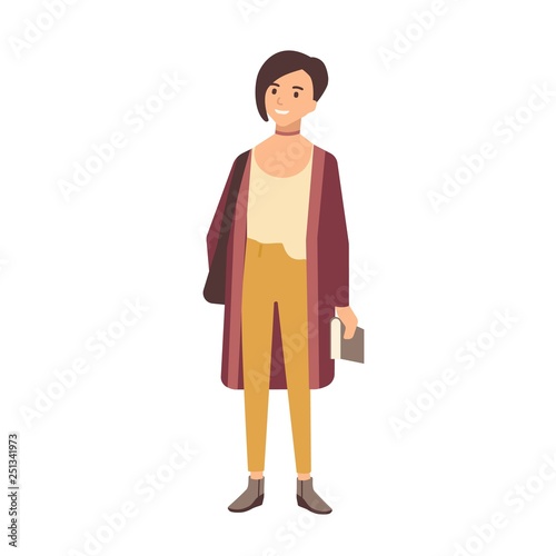 Cute smiling smart teenage school girl with short hair holding textbook