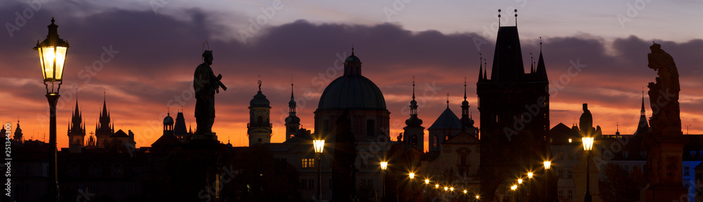 Prague - The silhouette of Charles Bridge and the Town