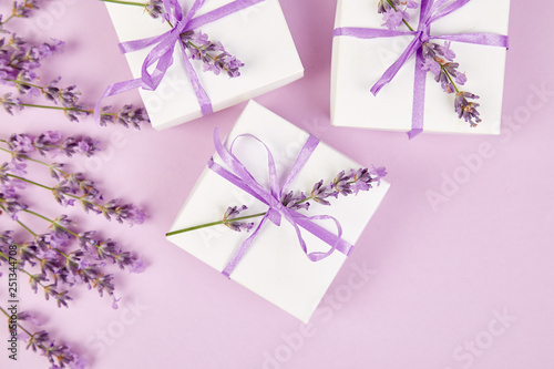 White Gift box with violet ribbon and lavender