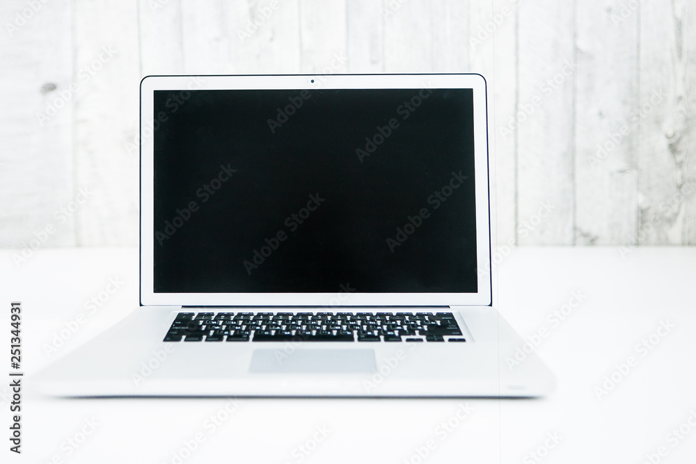 Opened laptop on a white ground Opened laptop on a white ground