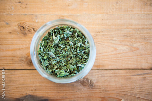 Green tea (herb) on a wood ground