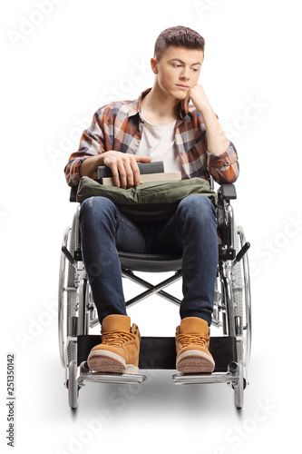 Young male disabled student in a wheelchair thinking