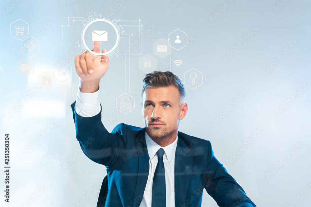 handsome businessman pointing on male icon isolated on white, artificial intelligence concept