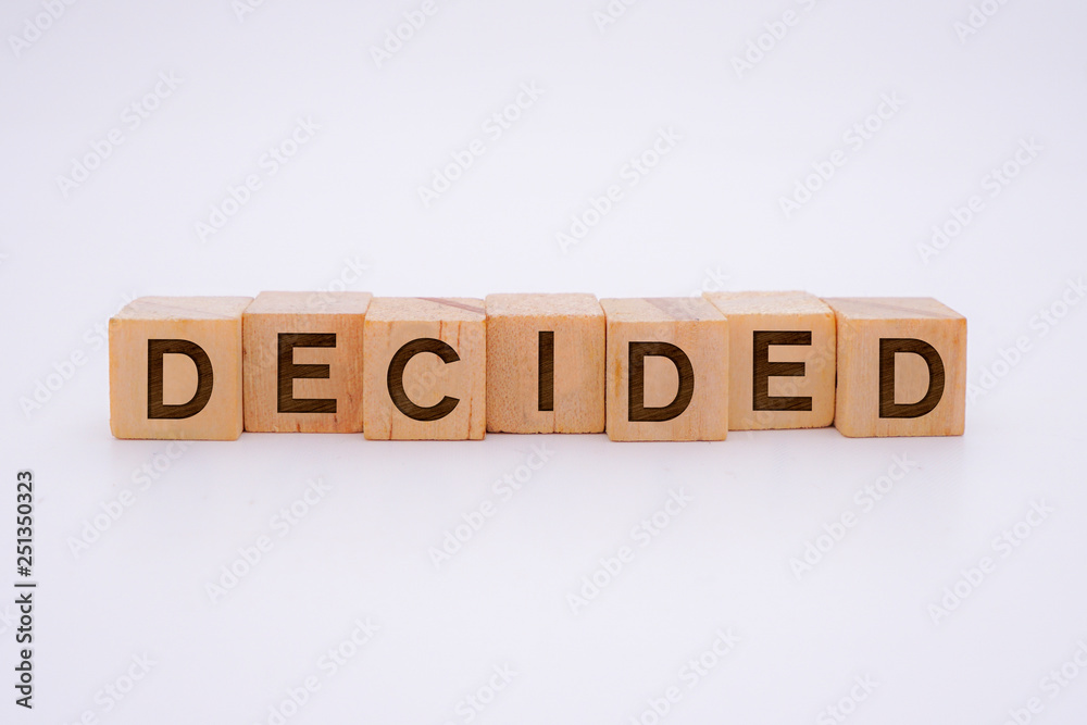 Decided Word Written In Wooden Cube Decided Word Written In Wooden Cube