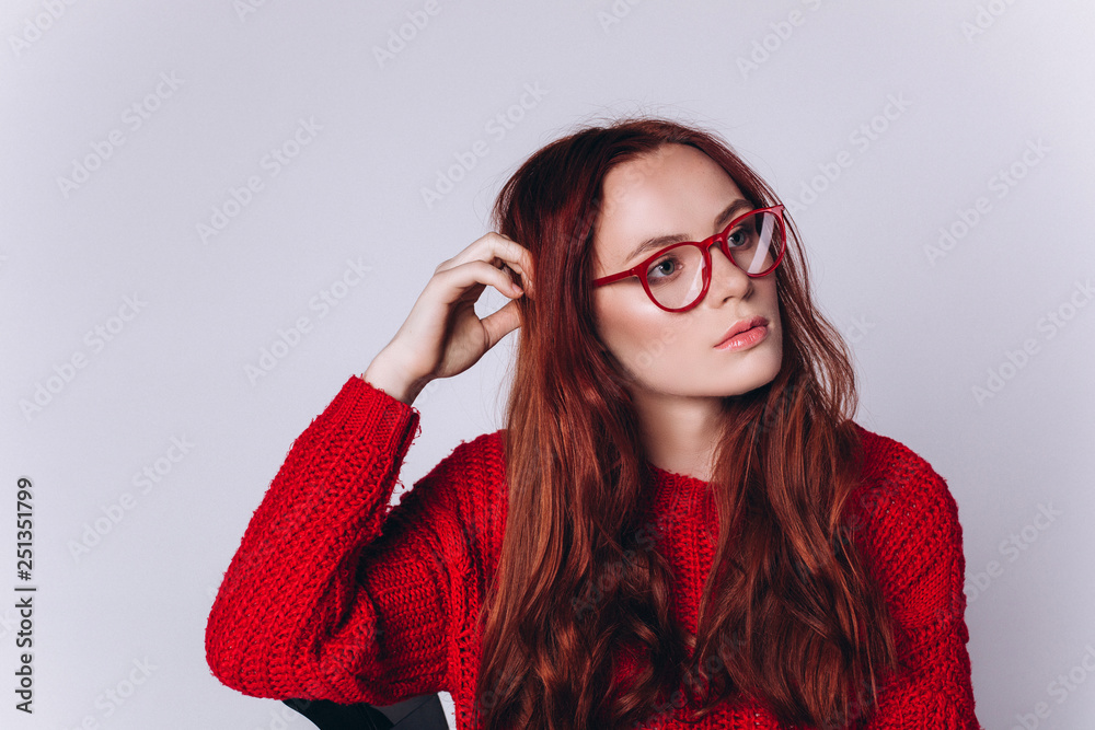 Portrait of young fashion gorgeous caucasian hipster girl with red headed hairstyle on white background in sun glasses. Beauty, commercial concept Portrait of young fashion gorgeous caucasian hipster girl with red headed hairstyle on white background in sun glasses. Beauty, commercial concept