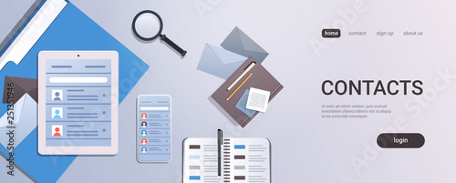 smartphone tablet screen and organizer with contact list business contacts concept top angle view workplace desktop with office stuff copy space horizontal